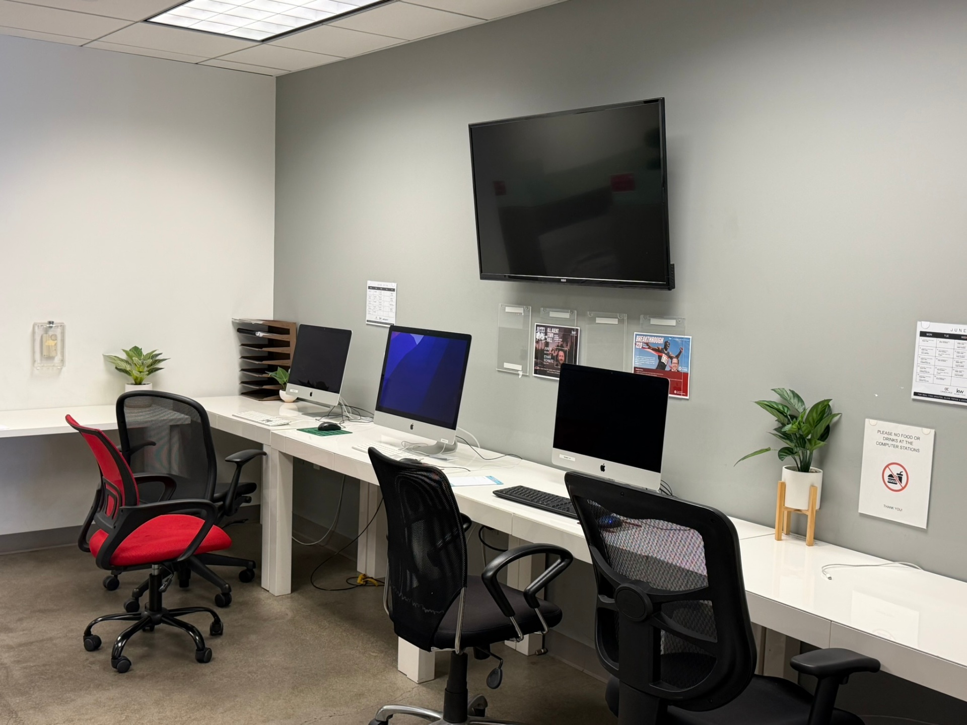 Agent workstations and iMac suite at the Keller Williams Beverly Hills office.