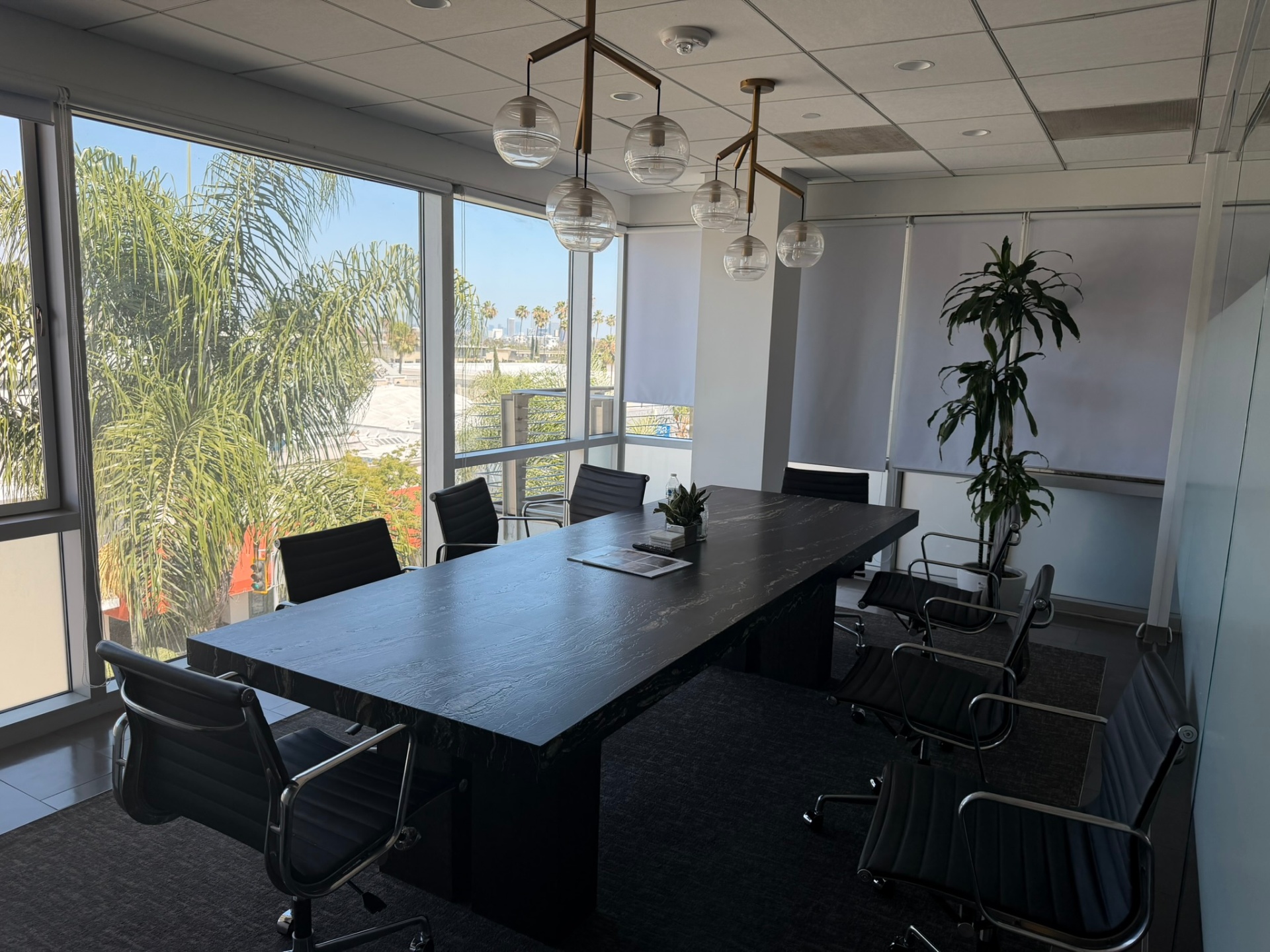 Conference room with floor-to-ceiling windows and Beverly Hills skyline view at CLI.