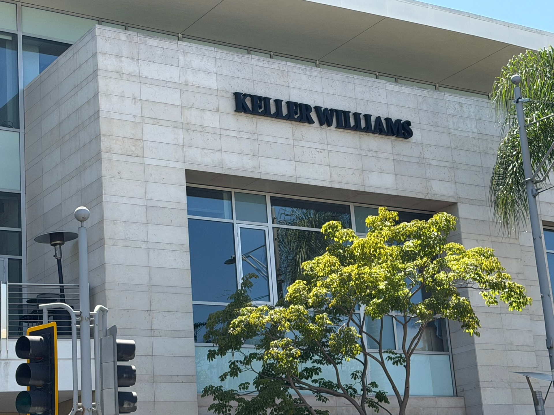 Keller Williams signage on the 439 N Beverly Drive building façade in Beverly Hills.
