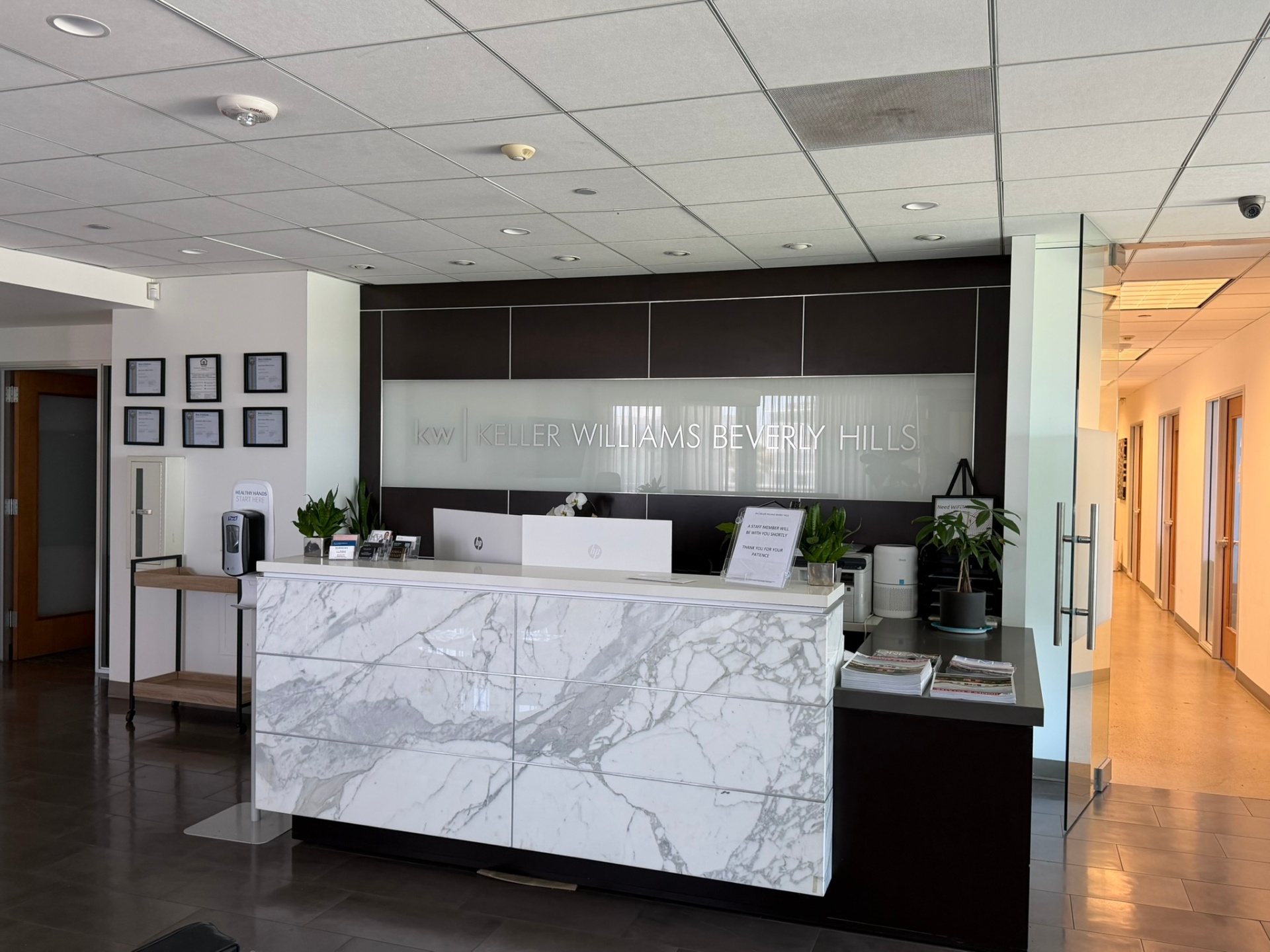 Keller Williams Beverly Hills lobby reception desk — California Luxury Investments office.